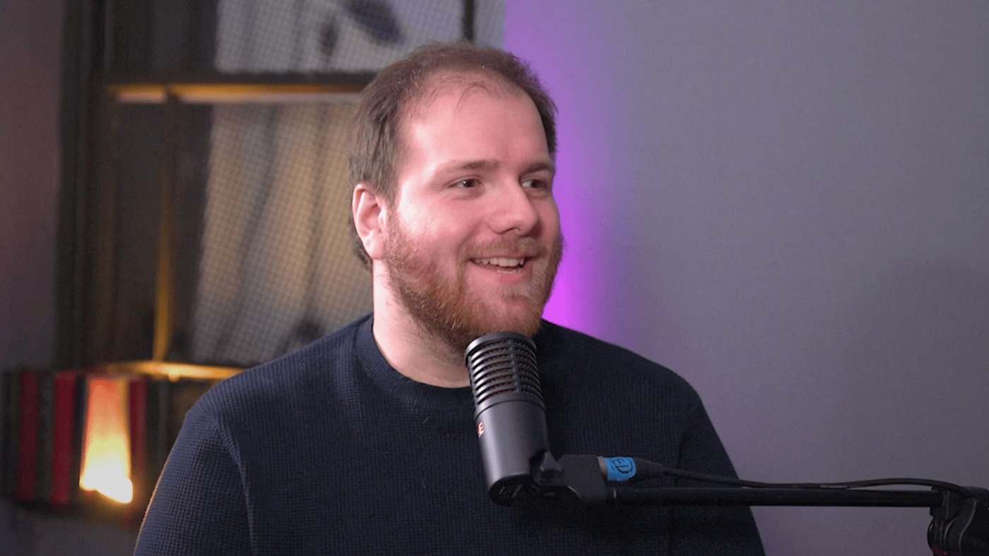 Oren Boder speaking into a microphone